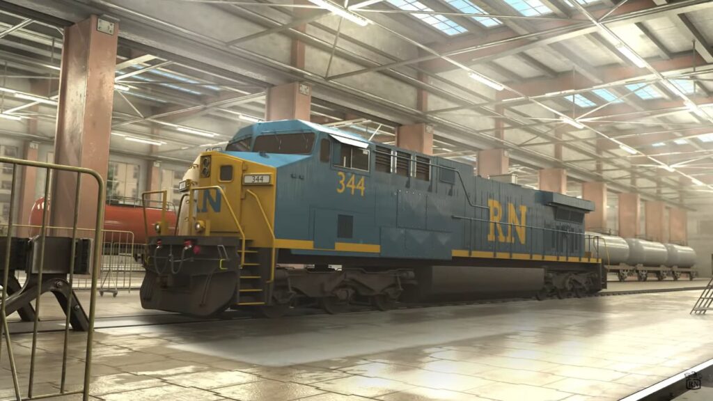 A blue and yellow diesel locomotive inside a train shed